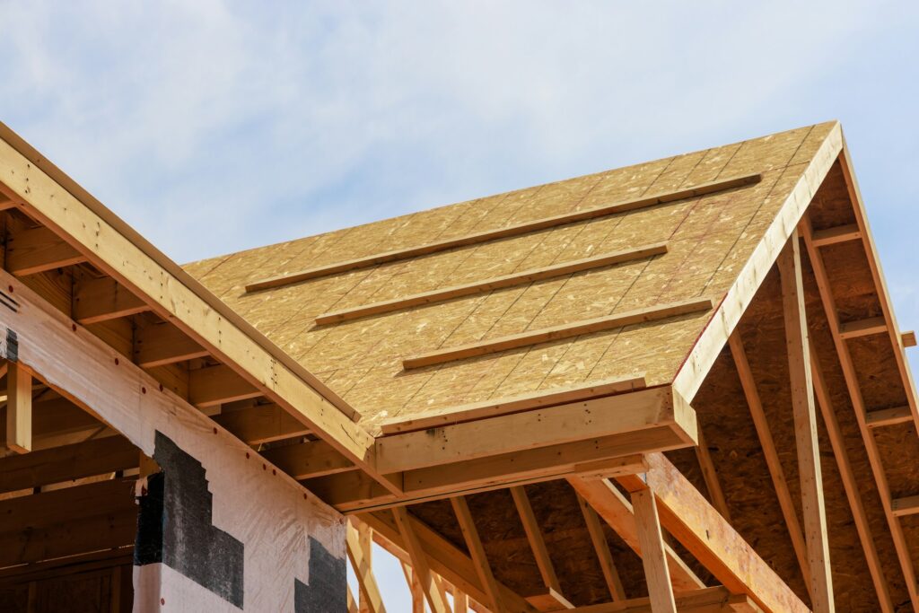 Developing a new house. Roof structure with wooden shingles.