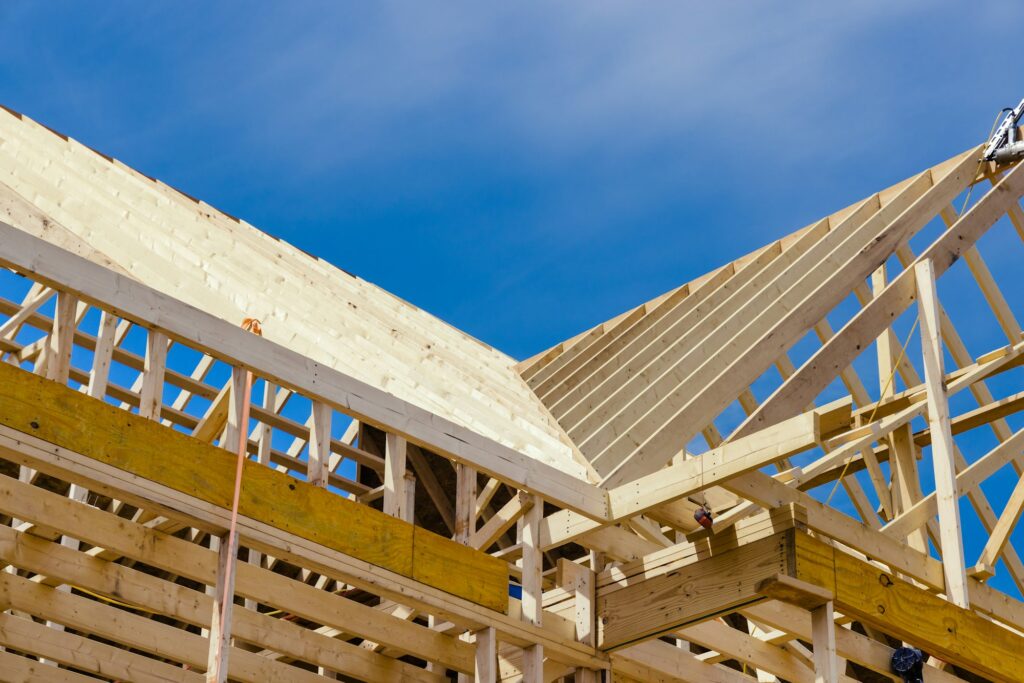 New residential construction home framing with a roof view